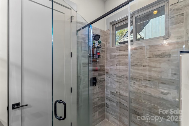 bathroom featuring a shower stall