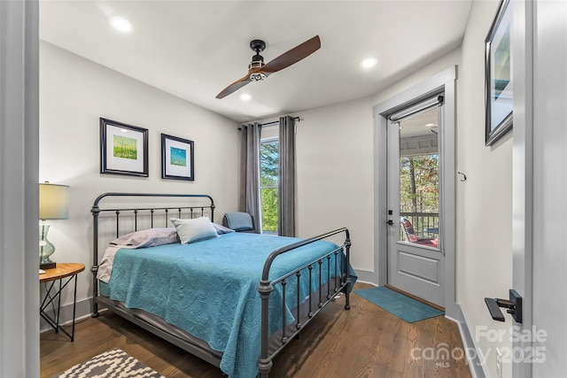 bedroom with dark wood-type flooring, recessed lighting, and multiple windows