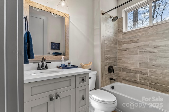 bathroom with toilet, bathtub / shower combination, and vanity