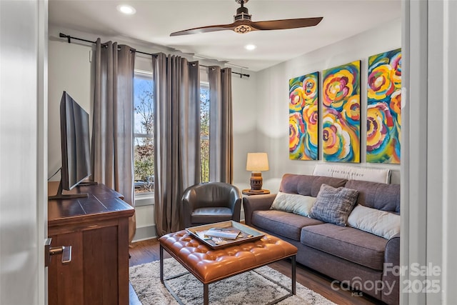 living area with recessed lighting, ceiling fan, and wood finished floors