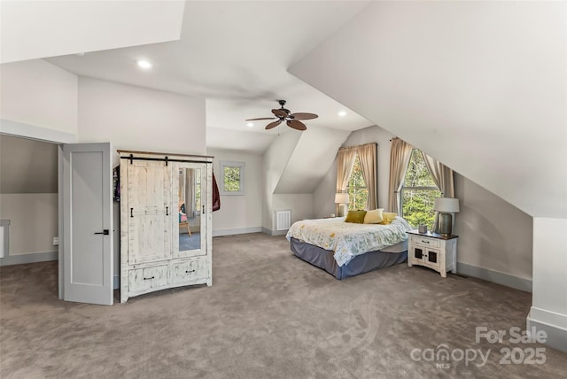 carpeted bedroom featuring lofted ceiling, recessed lighting, and baseboards