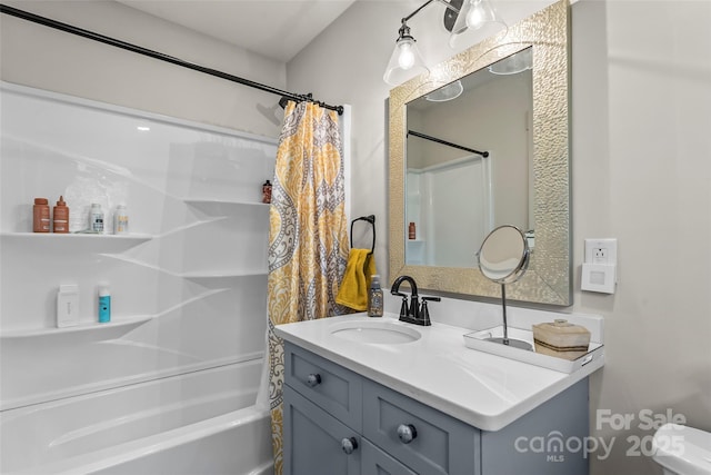 bathroom featuring shower / bath combo with shower curtain and vanity