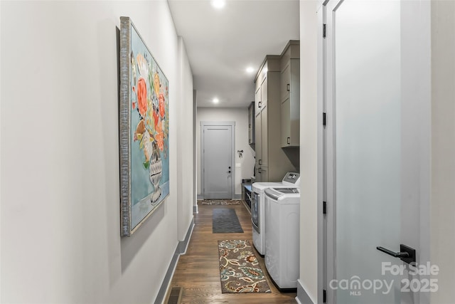 laundry room featuring cabinet space, baseboards, visible vents, dark wood-type flooring, and independent washer and dryer