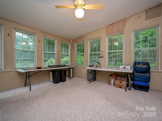 office featuring lofted ceiling, carpet, plenty of natural light, and built in study area