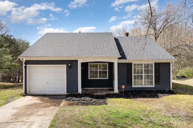 view of front facade featuring driveway, a front lawn, roof with shingles, and an attached garage