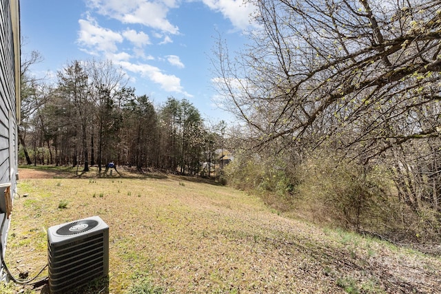 view of yard with central AC unit