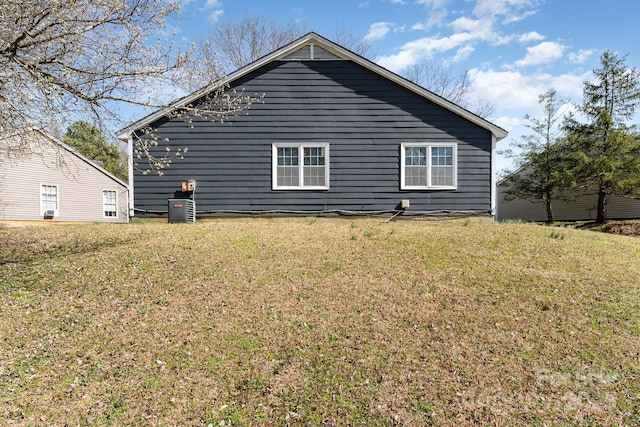 view of home's exterior with a yard