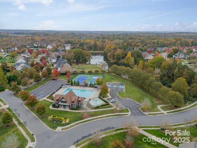 birds eye view of property with a water view