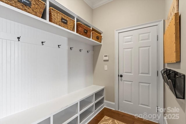 mudroom with dark wood-style floors and baseboards