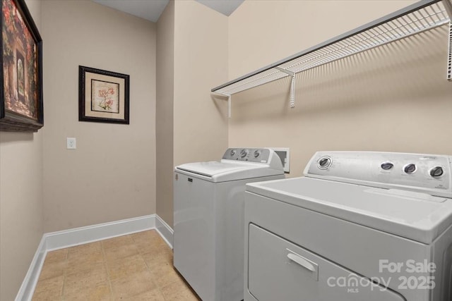 laundry area featuring independent washer and dryer and baseboards