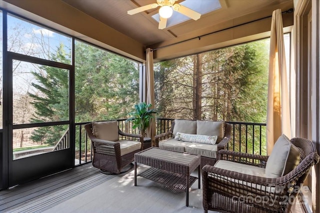 sunroom / solarium with a ceiling fan