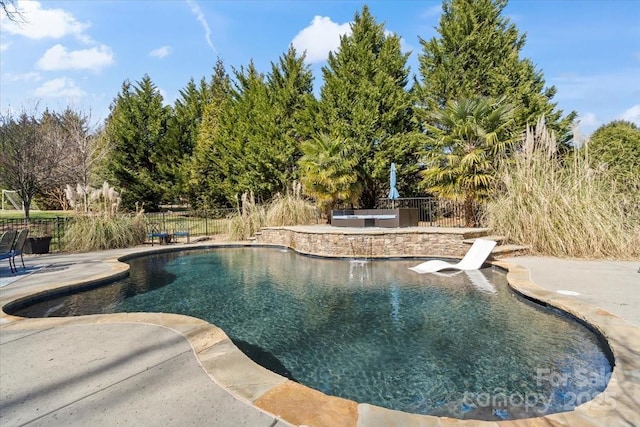 view of pool featuring a fenced in pool, fence, and a patio