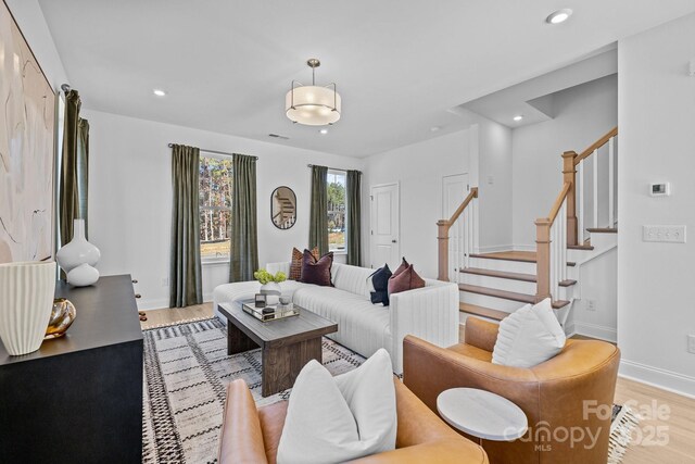 15332 Ballancroft Pkwy Unit 17, Charlotte, NC 28277 - living area with wood finished floors, stairs, recessed lighting, and baseboards
