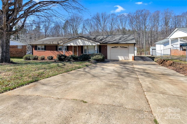 ranch-style house featuring a porch, a garage, brick siding, driveway, and a front yard