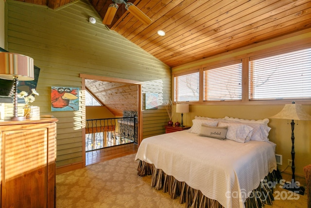 bedroom featuring lofted ceiling, carpet floors, wood ceiling, and wooden walls