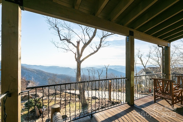 wooden terrace featuring a mountain view