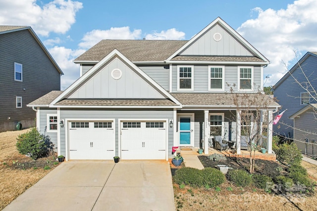 view of front of house with a shingled roof, a porch, board and batten siding, a garage, and driveway