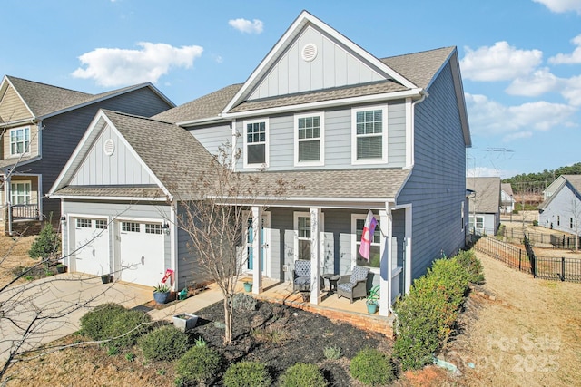 view of front of property featuring driveway, a porch, board and batten siding, and roof with shingles