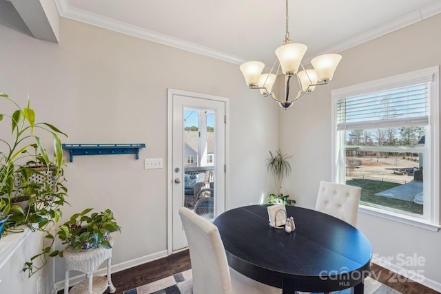1426 Whitman Ct, York, SC 29745 - dining room featuring plenty of natural light, ornamental molding, a chandelier, and dark wood-style floors
