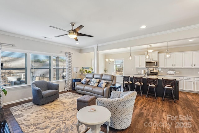 1426 Whitman Ct, York, SC 29745 - living room with dark wood-type flooring, ceiling fan, crown molding, a chandelier, and recessed lighting