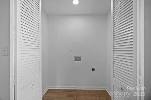 washroom featuring washer hookup, electric dryer hookup, wood finished floors, laundry area, and baseboards