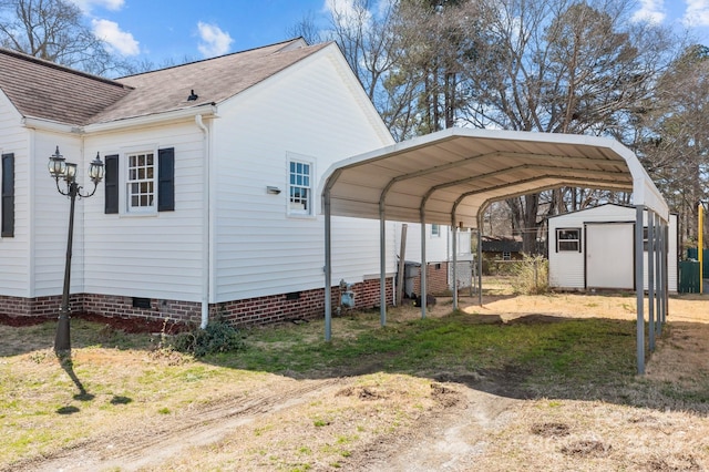 view of parking / parking lot with dirt driveway, a storage shed, and a detached carport