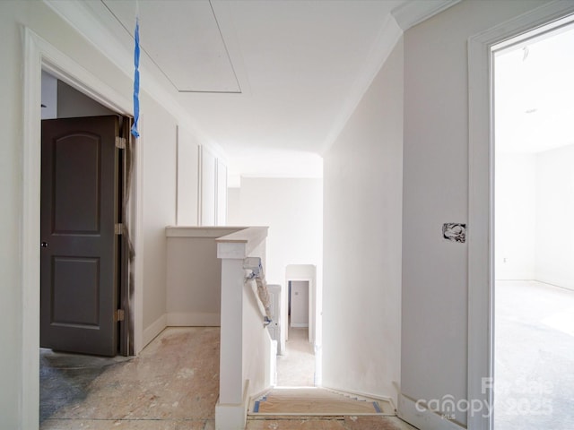 hallway featuring attic access and an upstairs landing