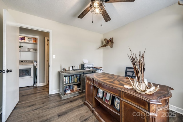 office area with dark wood-type flooring, ceiling fan, a textured ceiling, washer / dryer, and baseboards