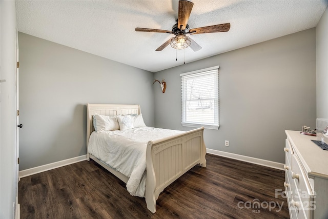 bedroom with dark wood-style flooring, ceiling fan, a textured ceiling, and baseboards