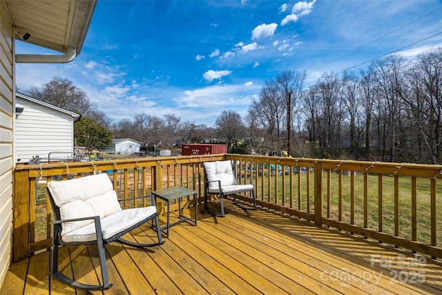 wooden terrace with a yard