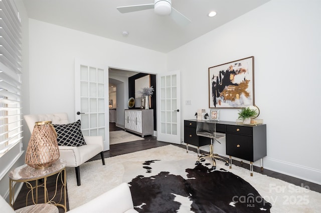 sitting room with ceiling fan, french doors, wood finished floors, and baseboards