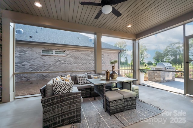 view of patio with ceiling fan, an outdoor living space, and area for grilling