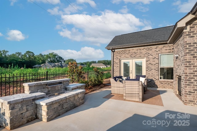 view of patio with french doors and fence