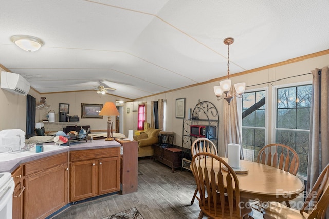 dining space featuring vaulted ceiling, ornamental molding, a wall mounted AC, and light wood-type flooring