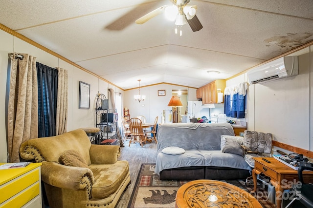 living area with a wall unit AC, crown molding, vaulted ceiling, wood finished floors, and ceiling fan with notable chandelier