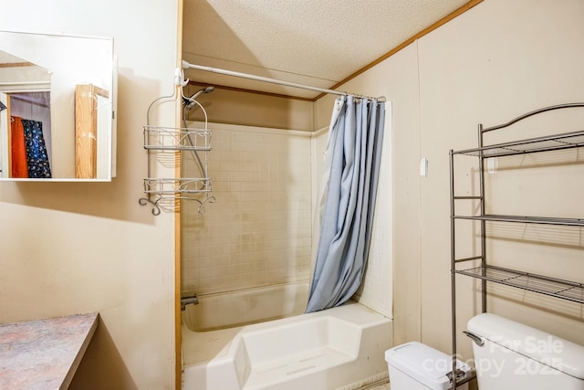 bathroom featuring shower / bath combination with curtain, ornamental molding, a textured ceiling, and toilet