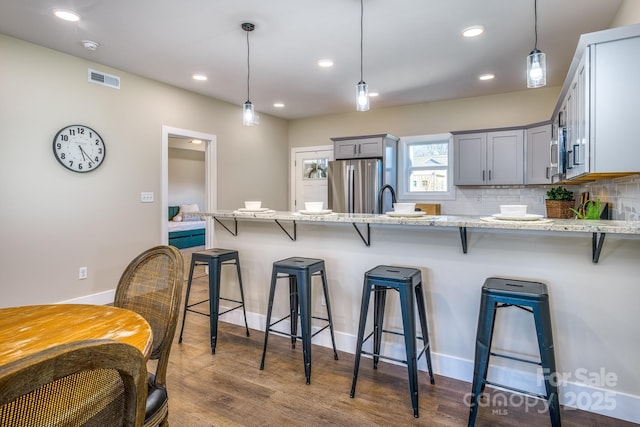 143 Carver St Unit 16, Brevard, NC 28712 - kitchen with freestanding refrigerator, gray cabinets, a peninsula, hanging light fixtures, and recessed lighting