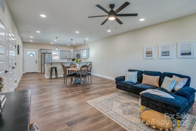 143 Carver St Unit 16, Brevard, NC 28712 - living area featuring a ceiling fan, recessed lighting, baseboards, and wood finished floors