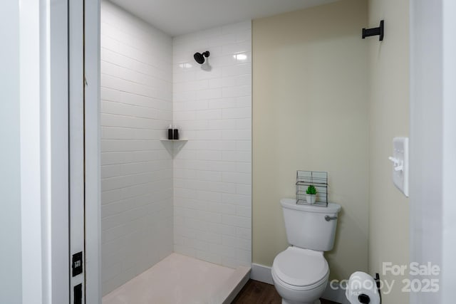 143 Carver St Unit 16, Brevard, NC 28712 - bathroom featuring a stall shower, toilet, wood finished floors, and baseboards