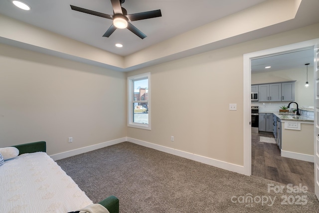 143 Carver St Unit 16, Brevard, NC 28712 - sitting room with dark colored carpet, a ceiling fan, baseboards, and recessed lighting