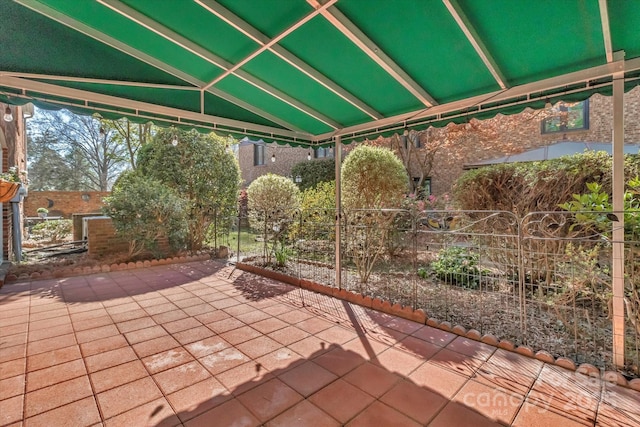 view of patio featuring fence