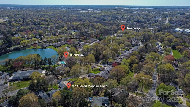 bird's eye view with a water view and a residential view