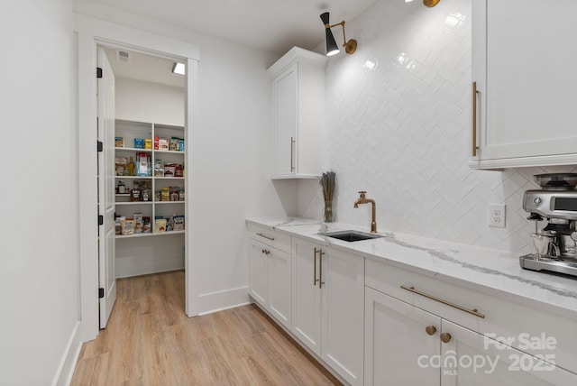 pantry with a sink