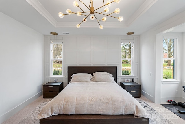 bedroom with baseboards, a tray ceiling, crown molding, and light colored carpet