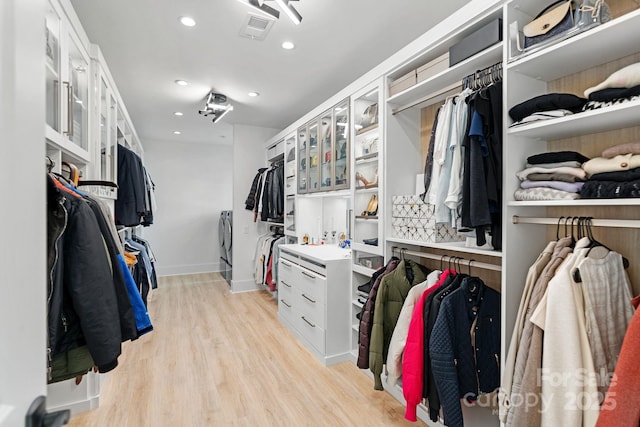 walk in closet with visible vents and light wood-style flooring