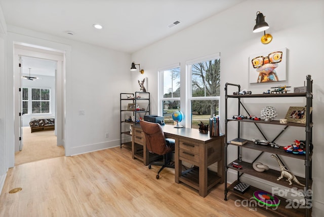 home office featuring recessed lighting, light wood-type flooring, visible vents, and baseboards