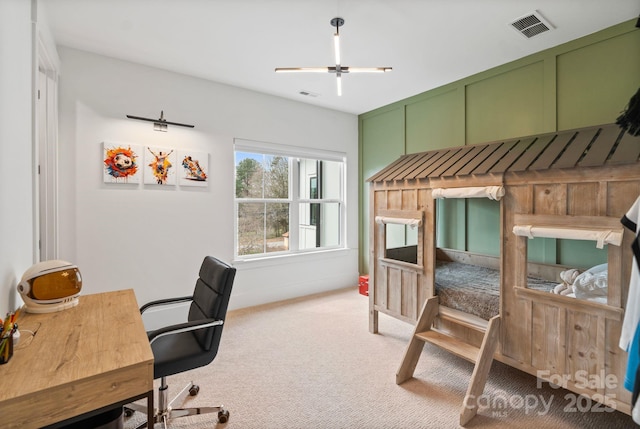 carpeted bedroom with visible vents