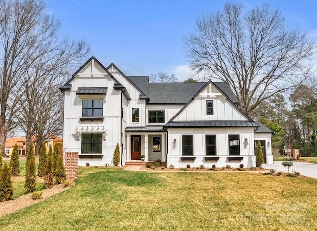 16112 Terry Ln, Huntersville, NC 28078 - modern farmhouse featuring board and batten siding, a standing seam roof, a garage, a front yard, and concrete driveway