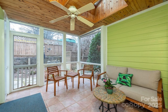 sunroom with wooden ceiling and a ceiling fan