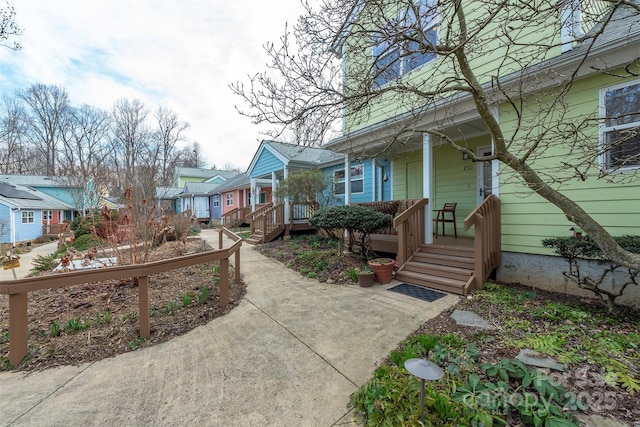 view of front of home featuring a residential view and covered porch